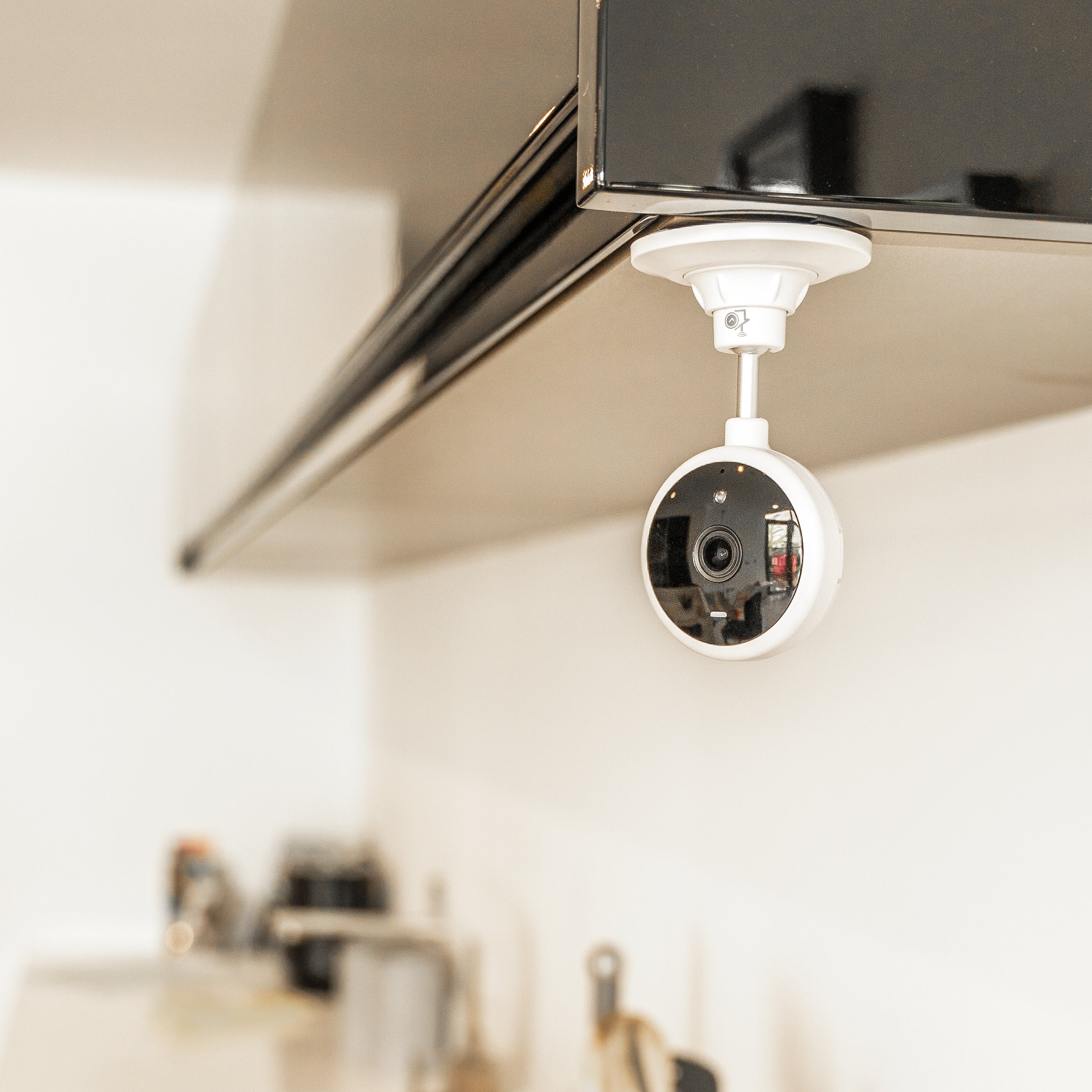 HomeOK smart home camera mounted on a cupboard